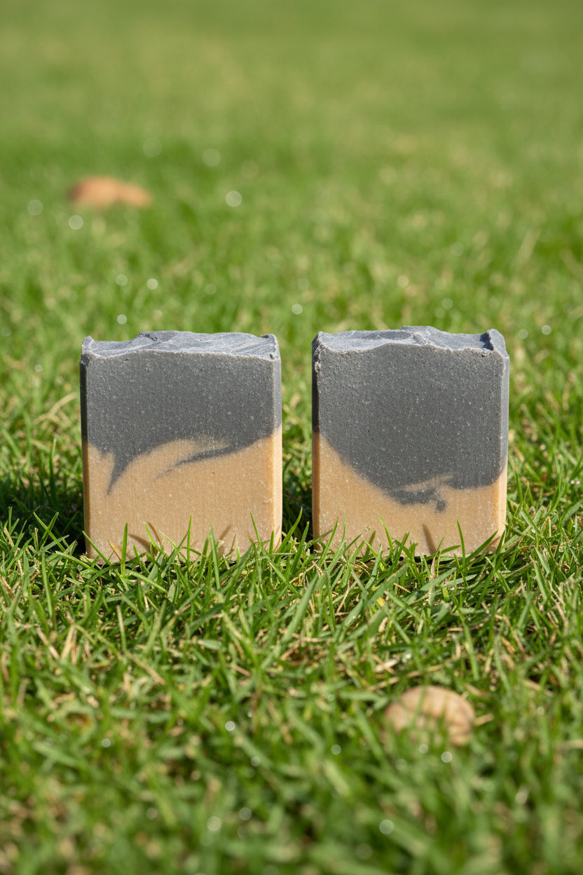 two deep mud soap with grass background