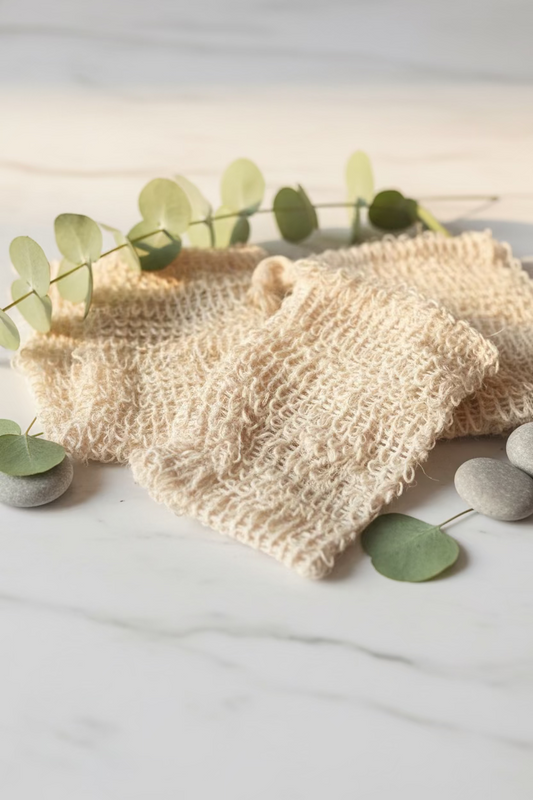 Three beige soap bag on a dark surface