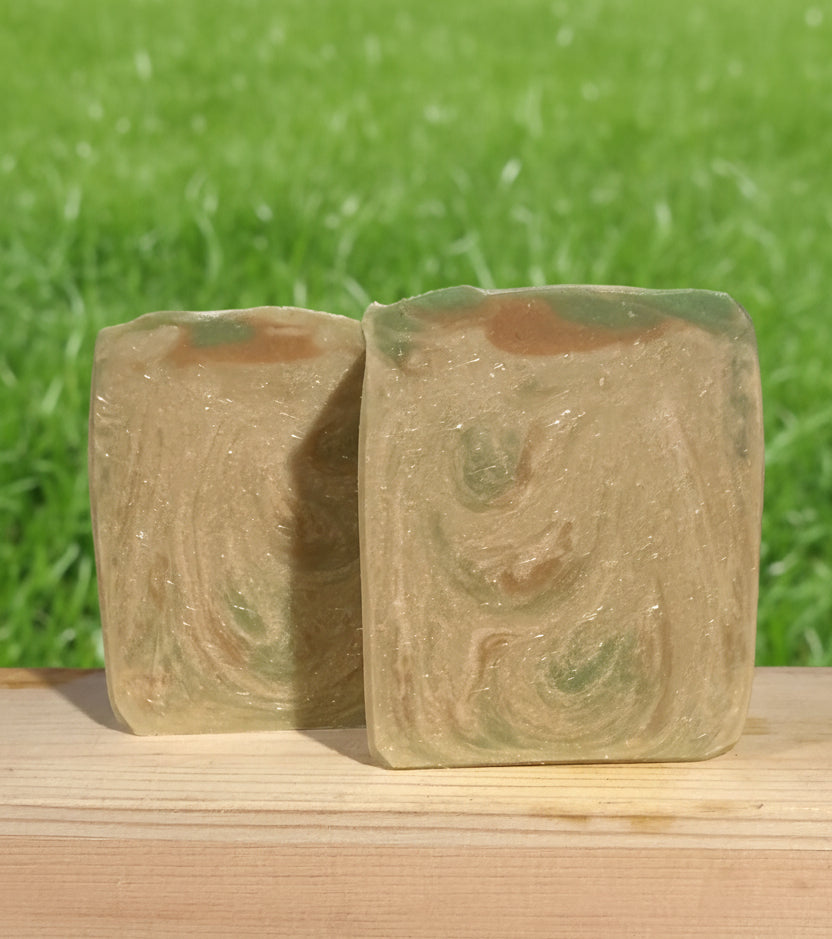 Coconut & Vanilla Goat Milk Tallow Soap Bar on a grass background